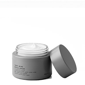 Kosmetiktiegel grau mit Creme gefüllt